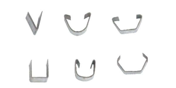 Six metallic fasteners in varied shapes (V, U, curved) on white background, industrial steel finish.