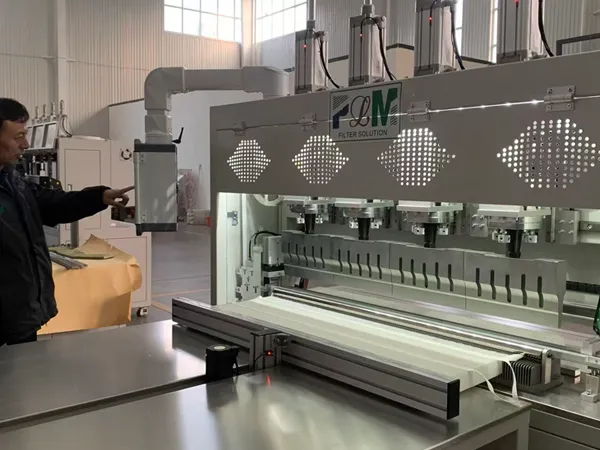 Operator training on a filter pleating machine for a complete filter factory solution.