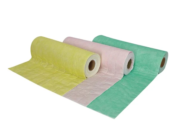 Three rolls of medium-efficiency filter media with different colors and a fiber layer