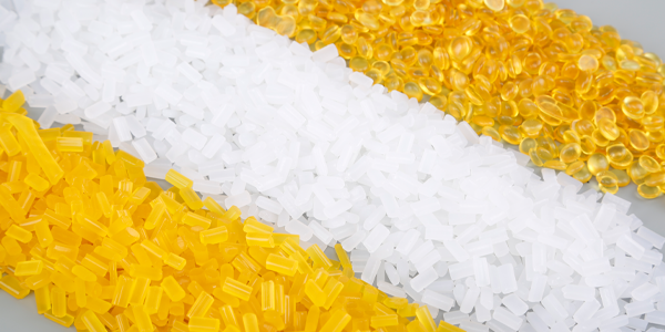 Hot melt adhesive particles of different colors and types