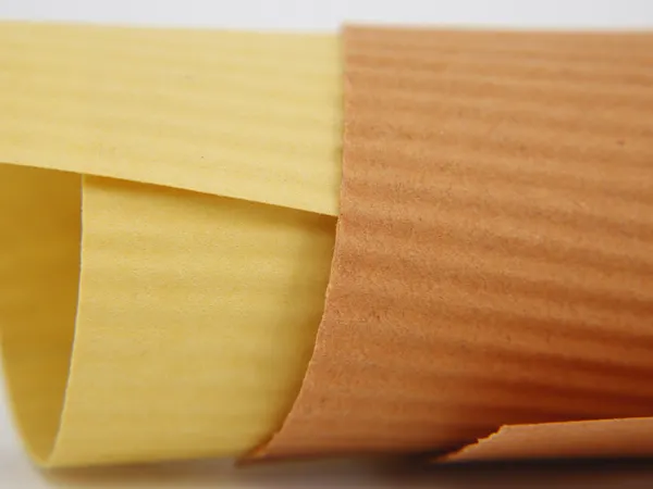 Two sheets of industrial filter paper of different colors