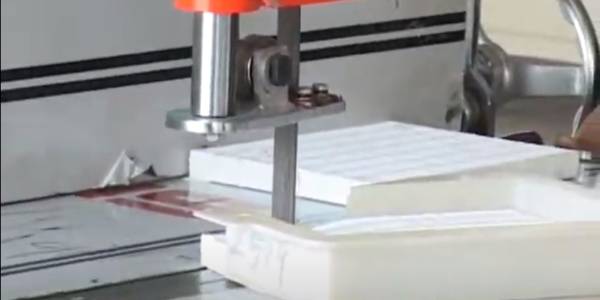 A machine is cutting filter paper